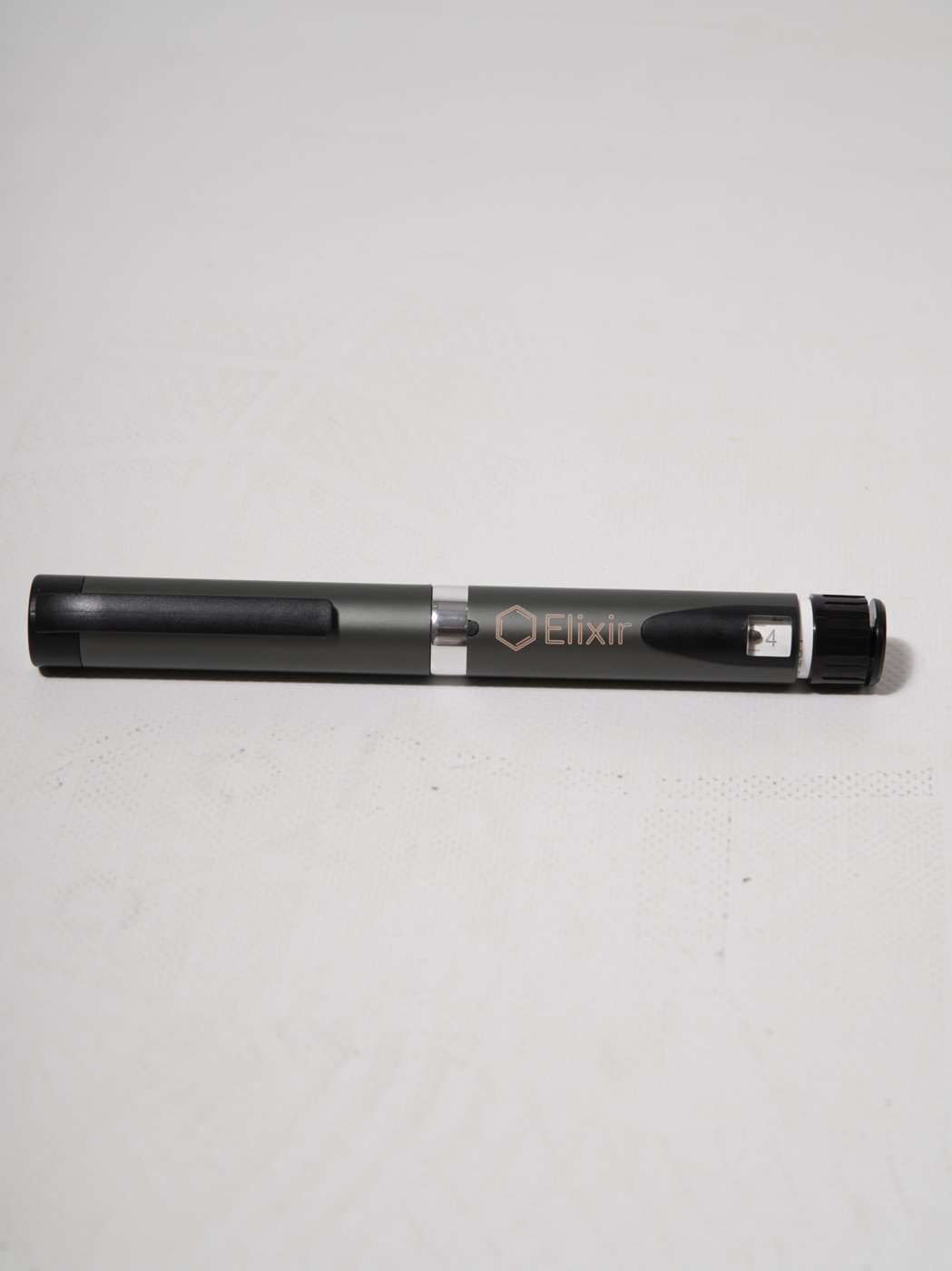 The Elixir precision pen in side profile on a white surface