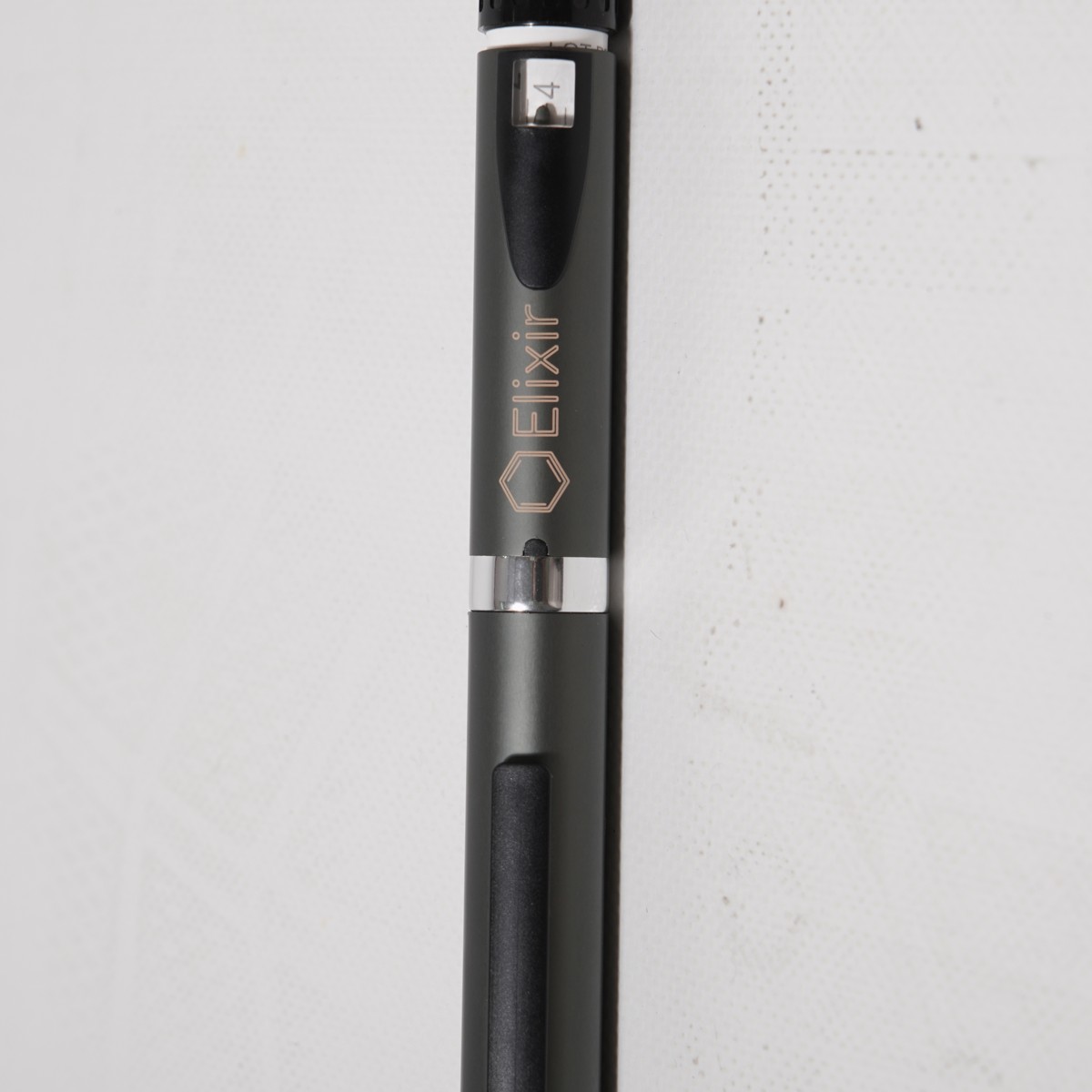 The Elixir pen upright, dose window and engraved wordmark in view